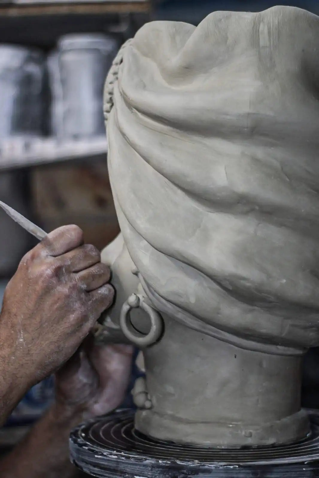 Clay sculpture or bust carefully crafted with sculpture tools.